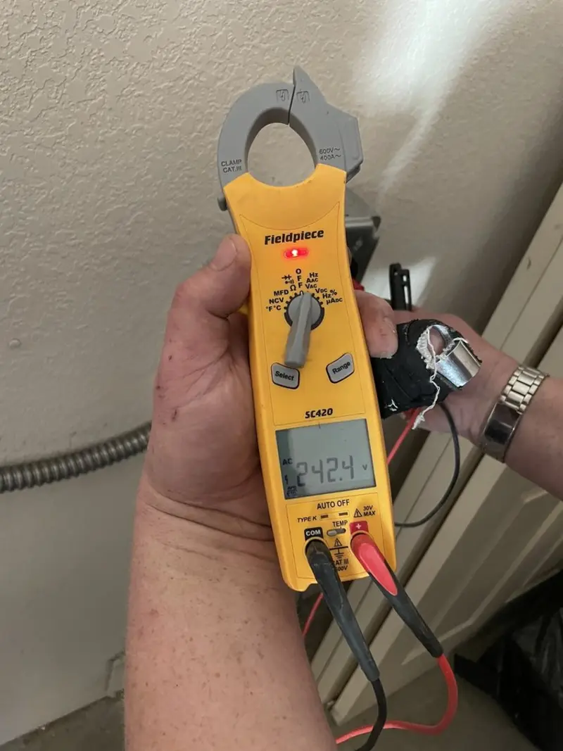 Voltage testing with clamp meter during Whole House Surge Protector in Hermitage
